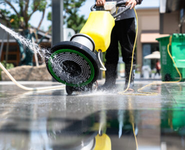 Cleaning woman housewife wash up dishes after dinner in the kitc
